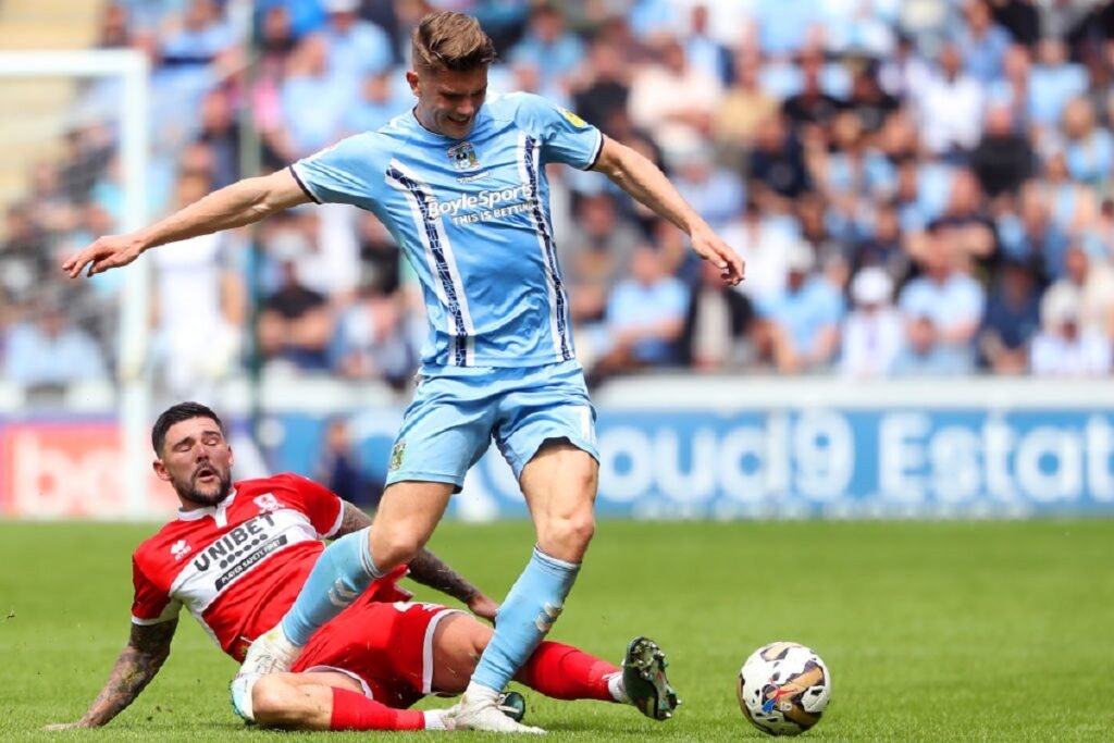 Viktor Gyokeres rides a tackle while playing for Coventry City.